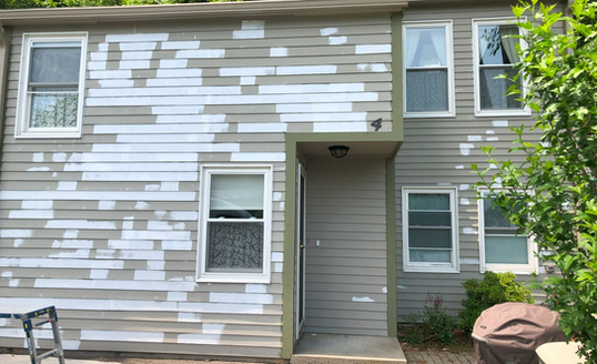 photo of damaged home siding needing exterior repairs.