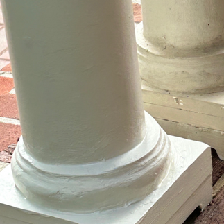 After photo of a damaged front porch pilar that has now been fixed and repaired then painted white with Benjamin Moore paint.