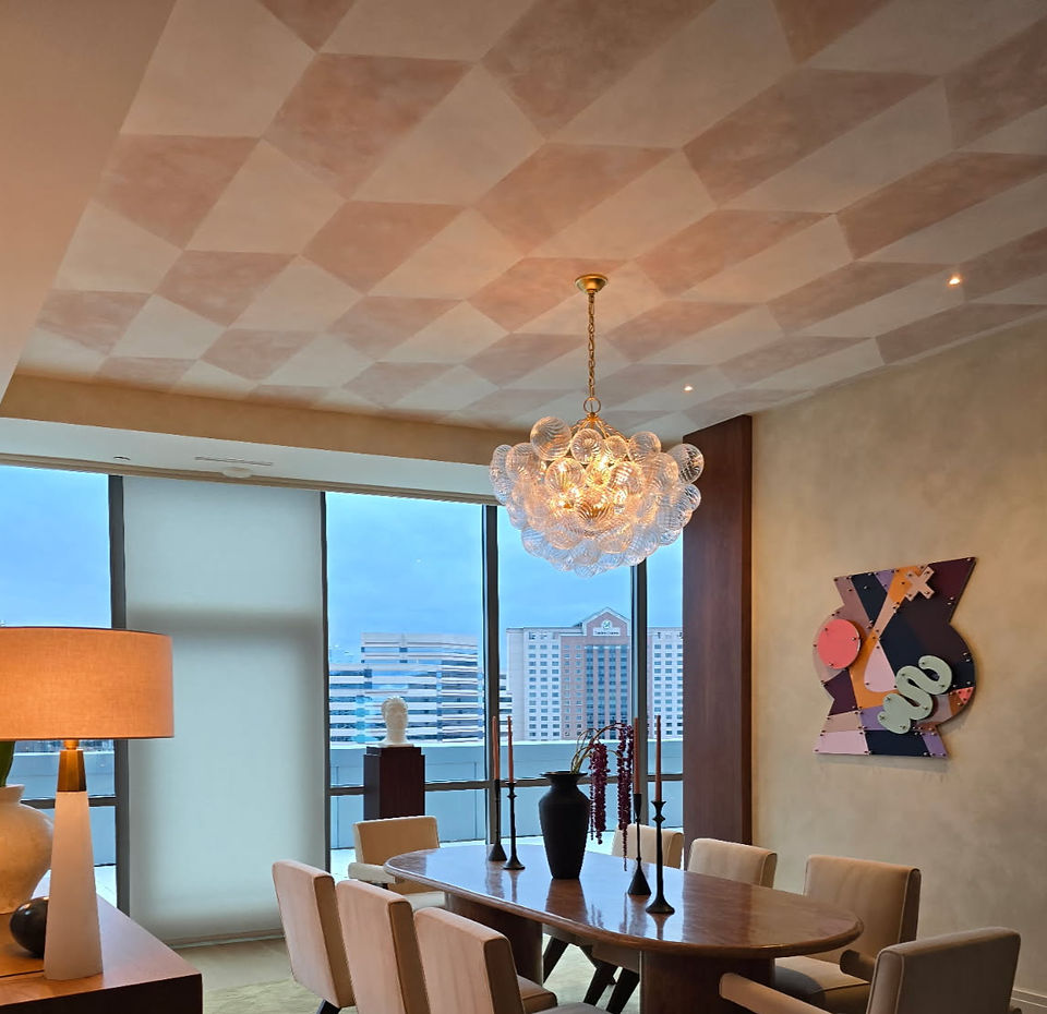 two color geometric lime wash on ceiling in an off red and white