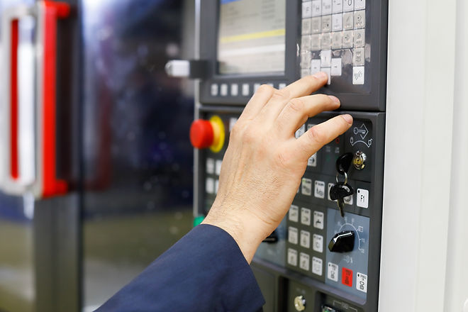 Operator working with CNC machining cent