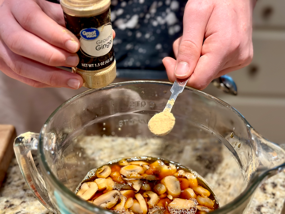 adding ginger to bowl with. wet ingredients