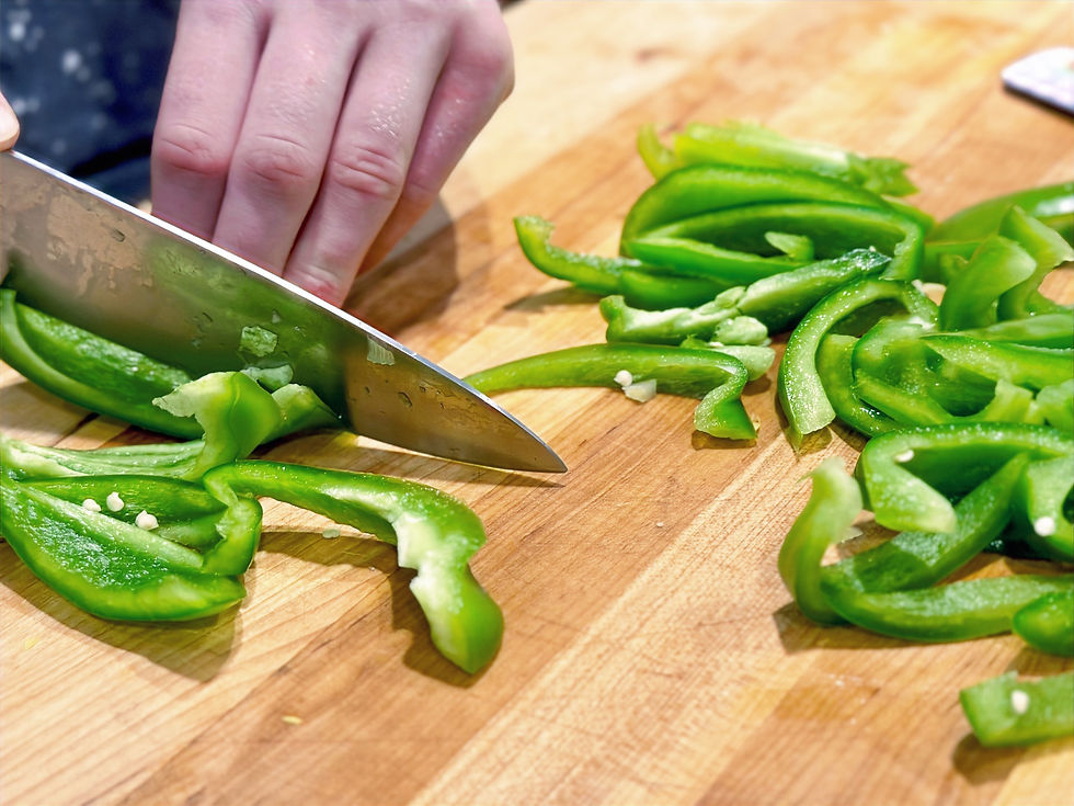 Knife slicing peppers
