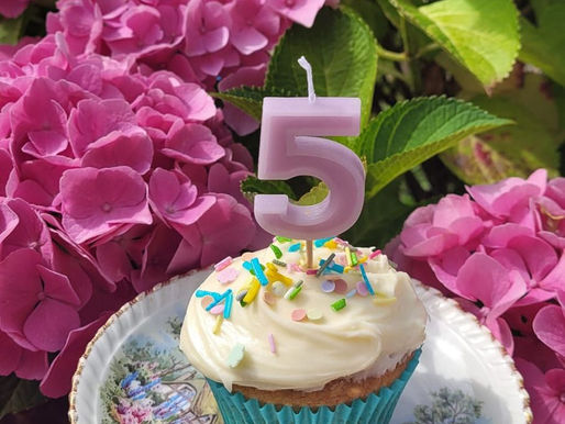 a 5th birthday candle in a cupcake