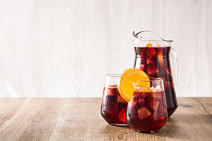 Red wine sangria in glasses on wooden table. Copyspace.jpg