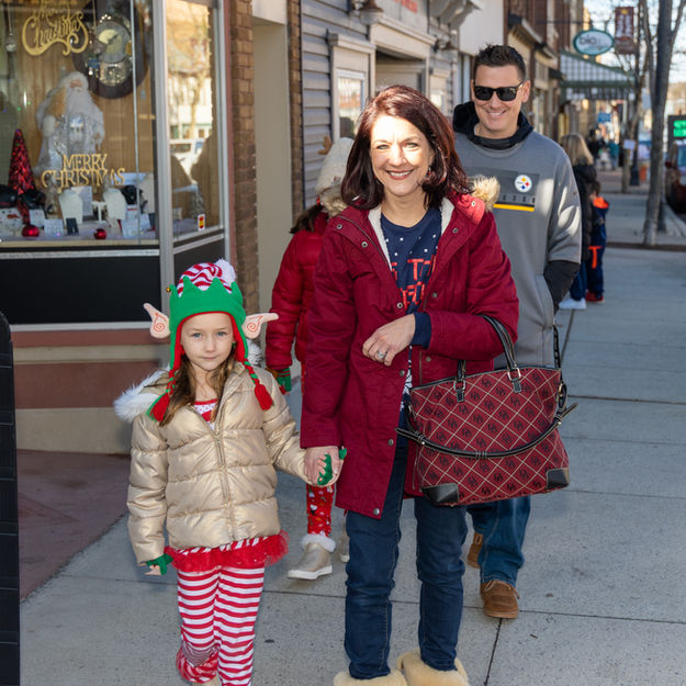 Family Christmas shopping on Main Street