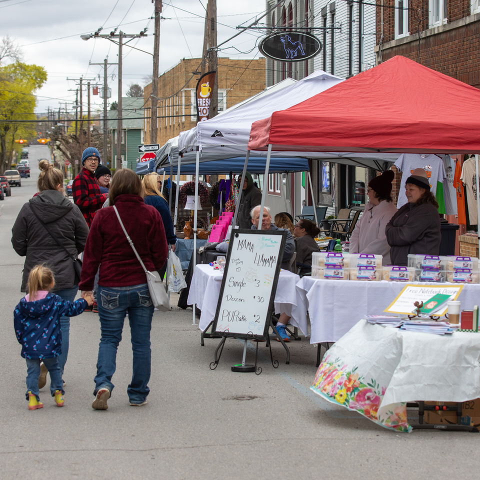 Busy Philipsburg street market with shoppers and vendors