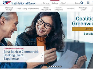 Two women smile over papers on First National Bank webpage, with Coalition Greenwich Awards Best Bank banner.