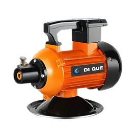 Japanese coupling concrete vibrator with orange and black motor housing, used for concrete consolidation in construction projects
