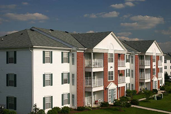 Multi-family condominium building with new asphalt shingle roof by Red Patch Roofing, serving Berks County, PA