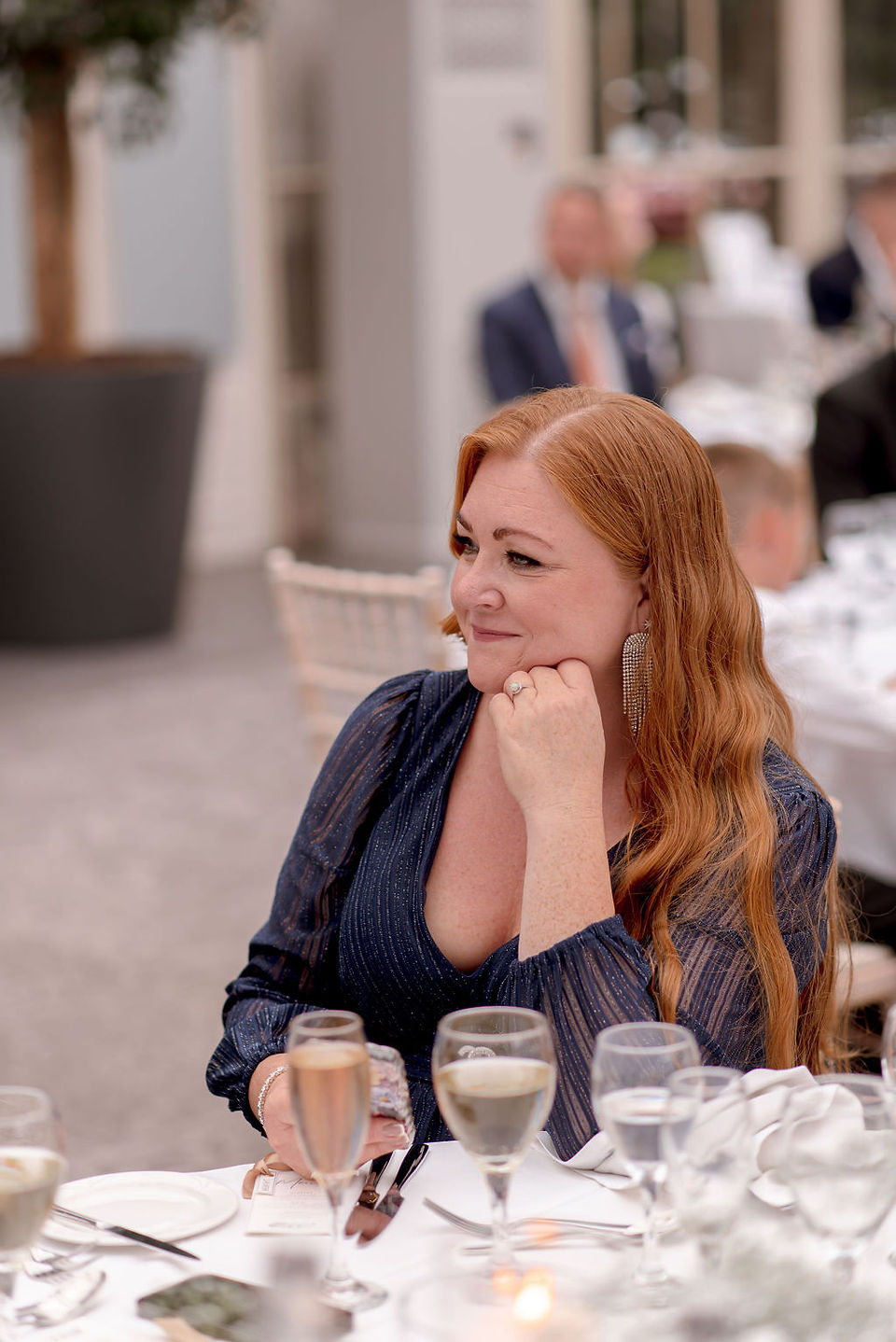 Candid wedding moment of newlyweds celebrating at Tortworth Court, captured by an experienced Tortworth Court wedding photographer during speeches 