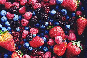Red strawberries, blue blueberries and blackberries