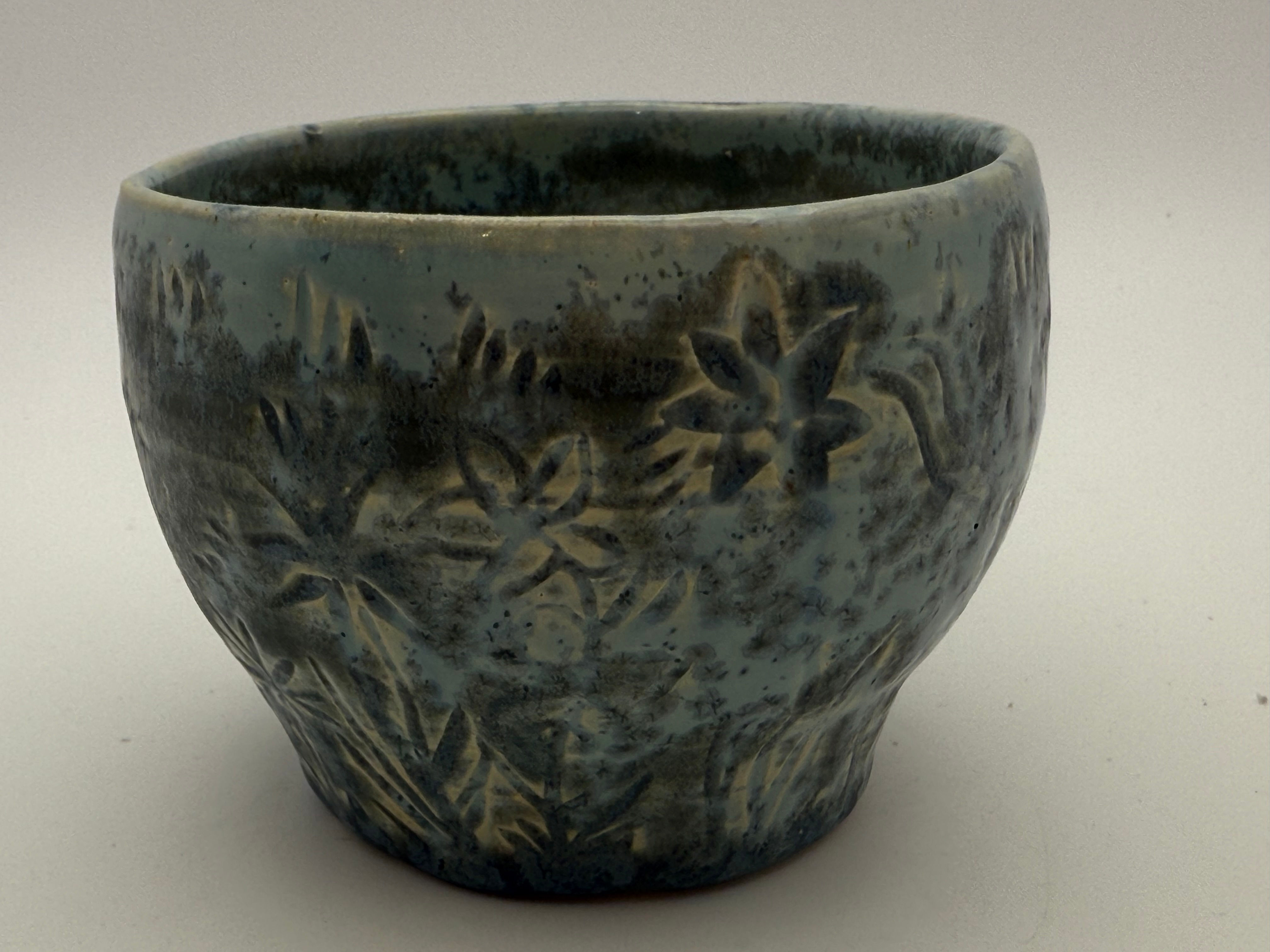 Plant pot with carvings of Plants