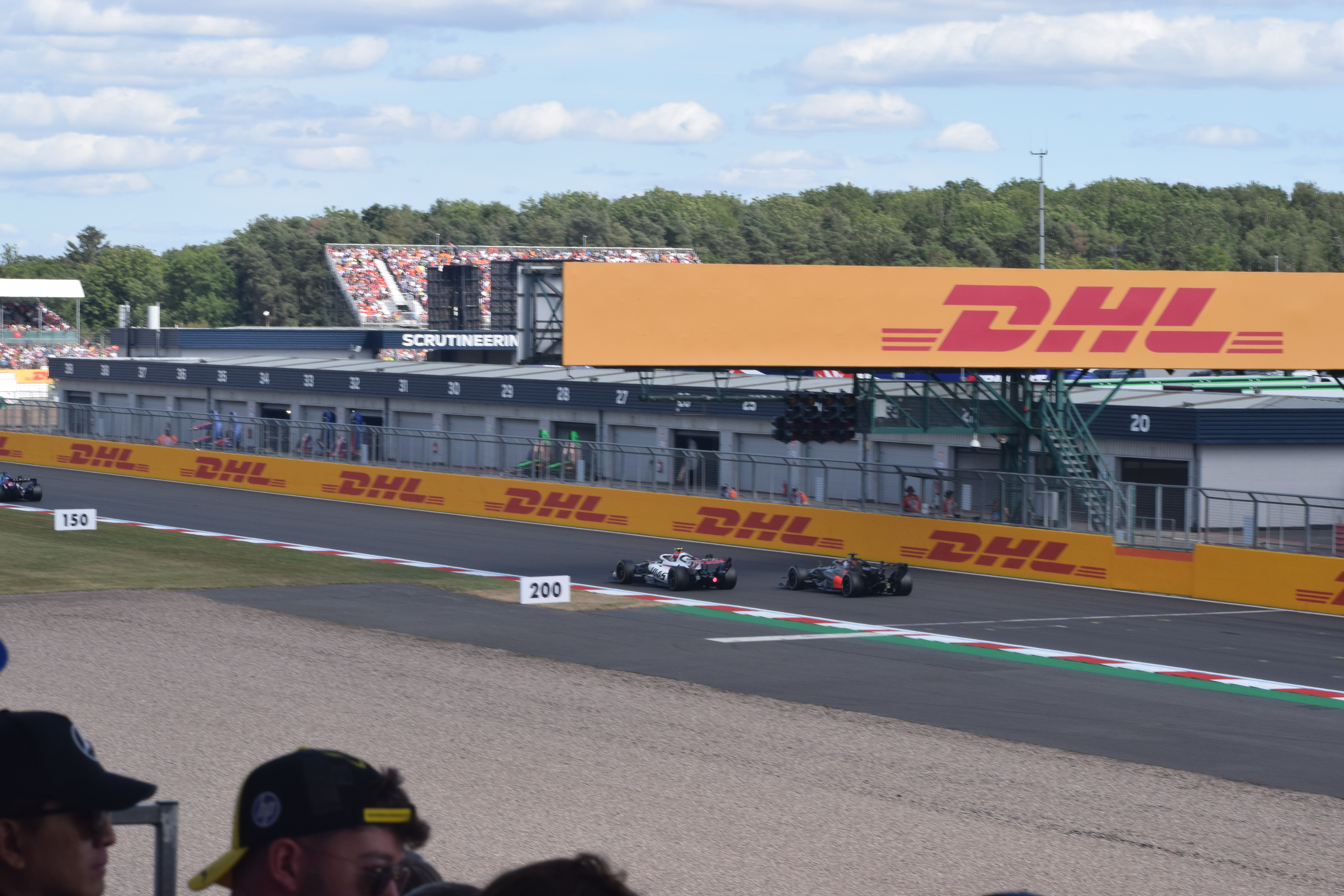 Haas and Audi Formula 1 cars close together on track at Silverstone in 2026