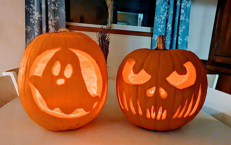 Carved jack-o'-lanterns displayed together at a Halloween gathering