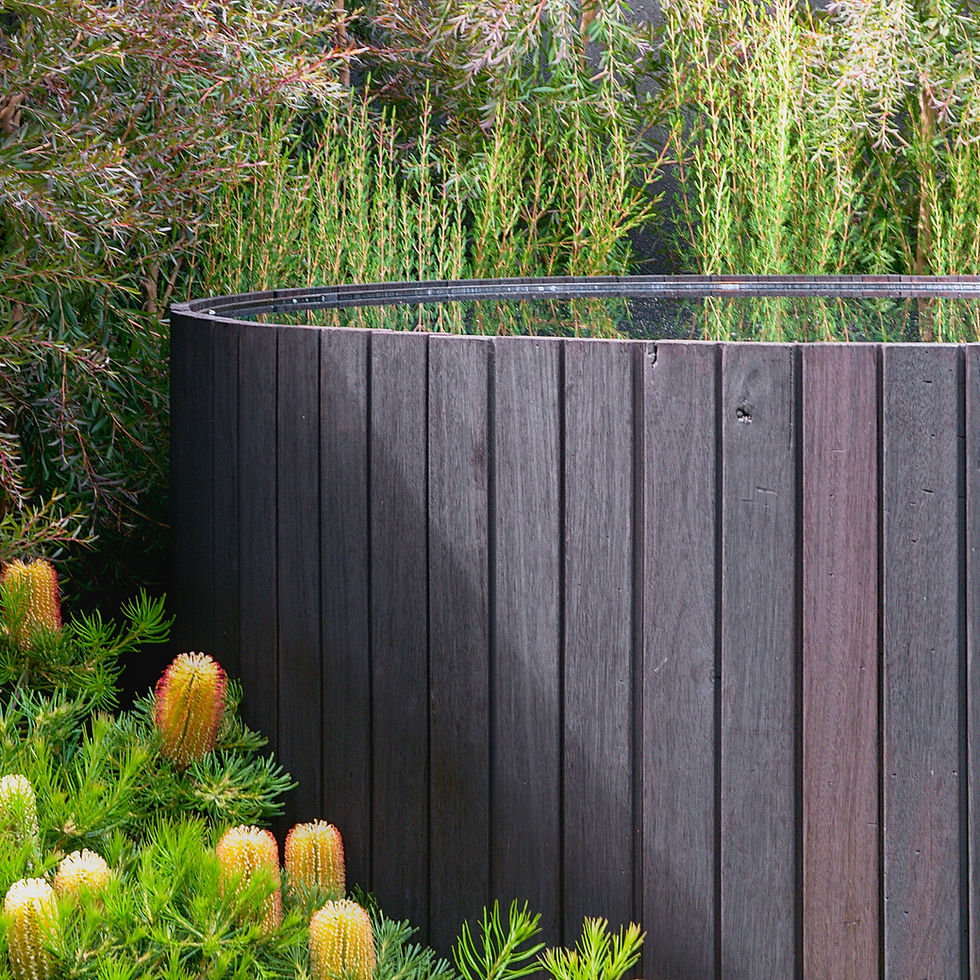 Charred cedar outdoor tub in show garden