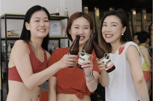 Chinese girls drinking Remedy