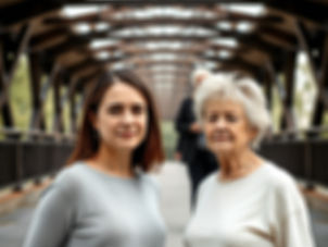 A mother and her daughter stand side by side with a bridge in the background