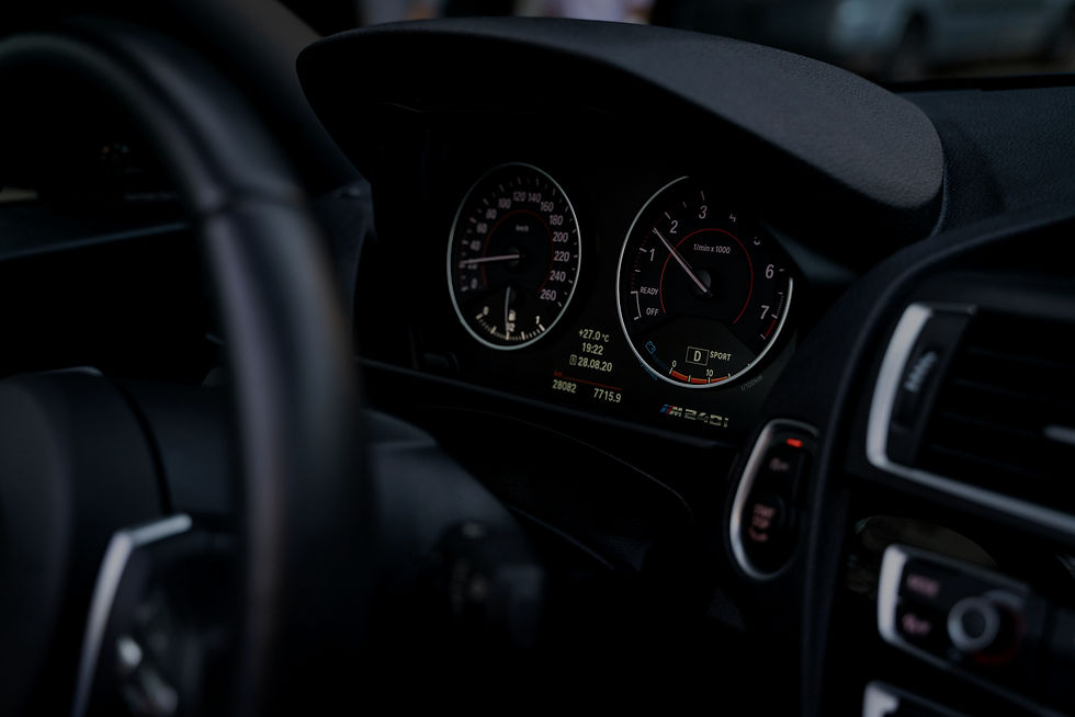 the dashboard of a car with a speedometer and gauges_edited.jpg