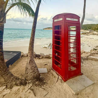 An old English phone booth on the beach