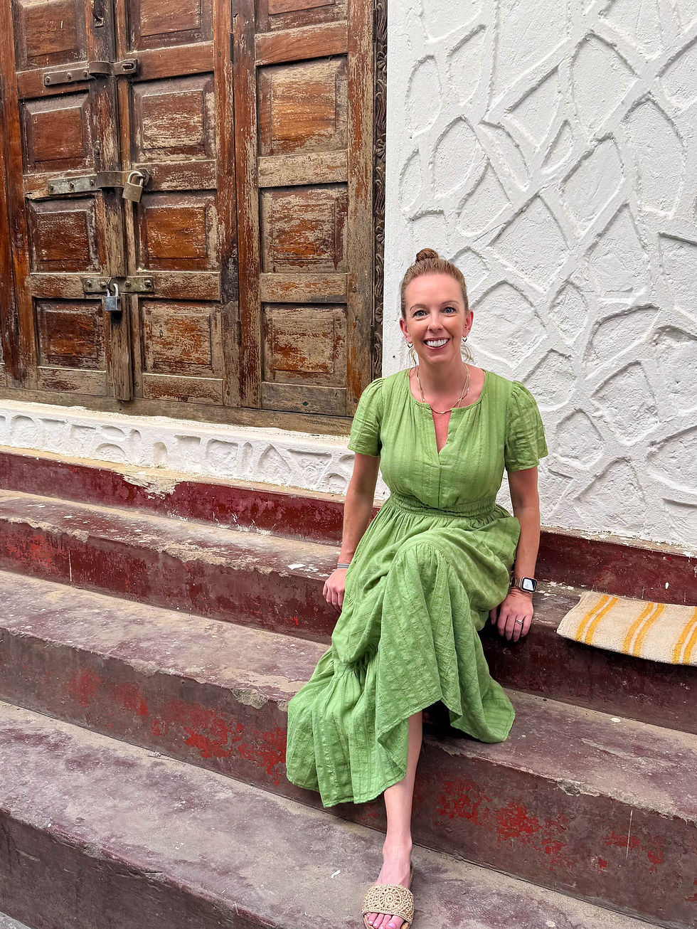 Pausing for a moment in front of one of Stone Town's famous doors.