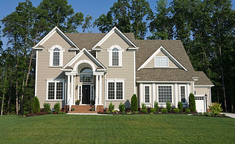 Residential Beige House with Green Lawn