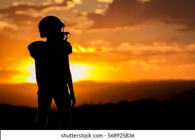 football-player-sunset-260nw-568925836 (1).webp