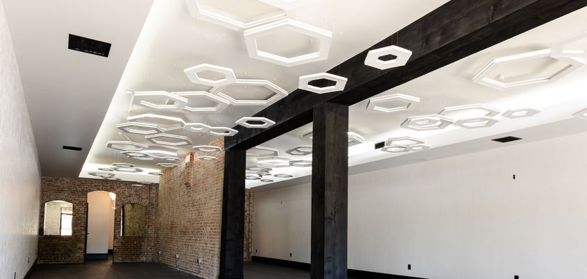 A casual dining restaurant proposed in one of Redding's oldest buildings. We designed a beautiful modern space to complement the existing brickwork and added a eye-catching suspended hexagonal lighting component. 