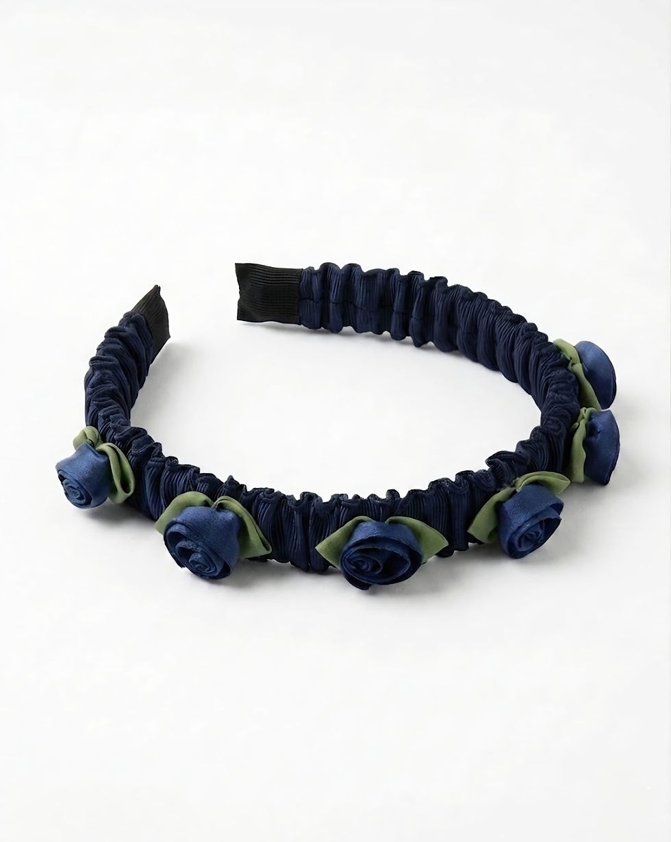 Girls navy floral headband featuring satin rose flowers and soft gathered band, perfect for weddings and dressy outfits