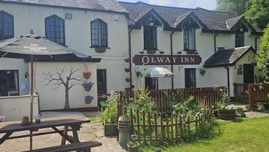 The Olway Inn is a charming 17th-century country pub, restaurant, and B&B situated on Chepstow Road just outside the historic town of Usk, Monmouthshire. Nestled in the scenic Welsh countryside alongside the gentle trout waters of the Olway Brook, it is highly regarded for its traditional character, exceptionally generous home-cooked meals, and its outstanding hospitality toward campervans and motorhomes.