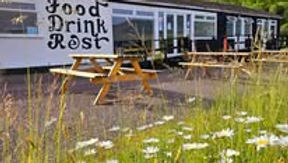 The Pitstop at Kintail is a popular licensed roadside café, restaurant, and motorhome stopover located along the A87 in the scenic Scottish Highlands. Situated in Ault a' Chruinn near Glenshiel, it sits directly on the primary route to the Isle of Skye. The venue delivers classic Highland hospitality alongside dramatic, panoramic views over Loch Duich and the iconic Five Sisters of Kintail mountains.