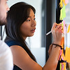 Focused asian business woman mentor coac