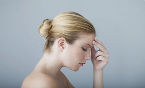 Woman Touching Forehead