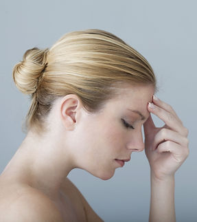 Woman Touching Forehead