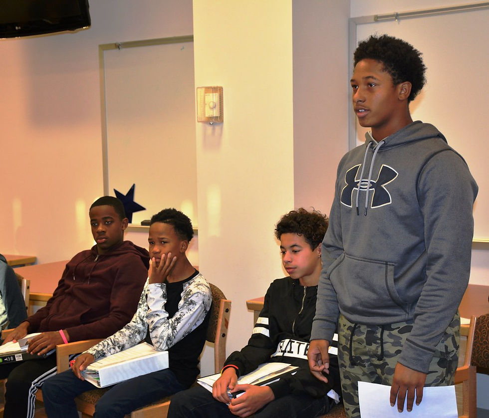 Young men listening in a mentorship session