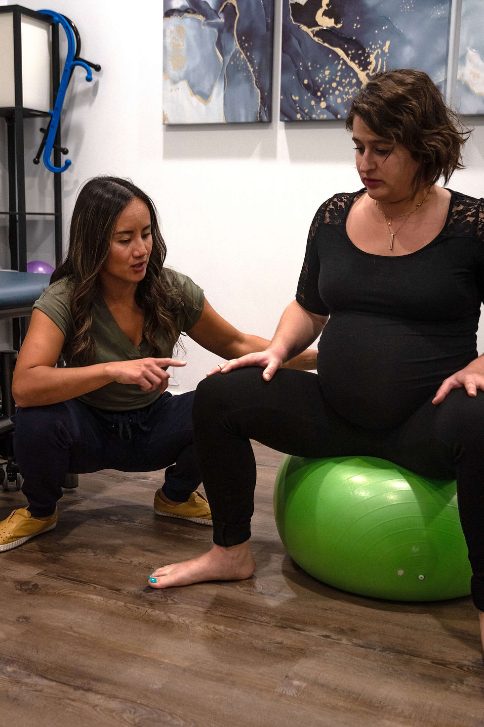 christine helping client with pelvic floor exercise (1).jpg