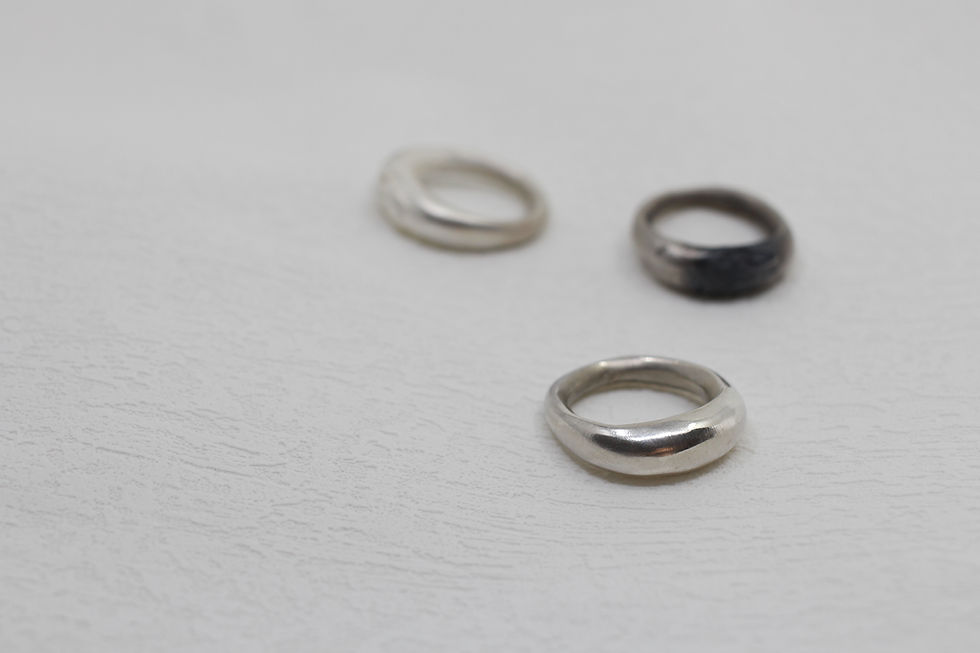 Front view of three lamp rings made of sterling silver.