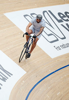 Man cycling on the velodrome track
