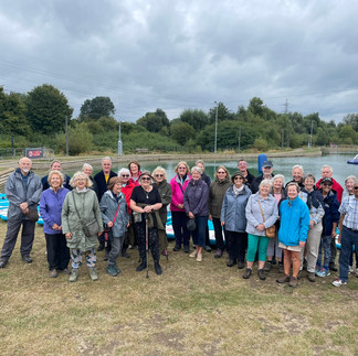 Group of people standing in front of the lake at Lee Valley White Water Centre