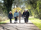 Walk leader and walking laughing while walking