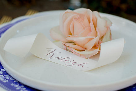Elegant scroll place card at a dinner place setting