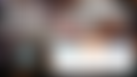 Security cameras overlooking a manufacturing facility production line with cost comparison cards showing small facility 8-16 cameras, mid-sized facility 20-60 cameras, and large multi-building facility 60-200+ cameras — How much do security cameras cost for manufacturing — GenX Security Solutions serving SC, NC, and GA since 2003