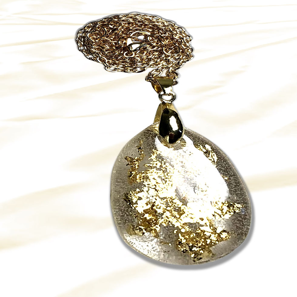 Elegant tear-drop pendant with gold flecks on soft white background. KCM Gifts4You