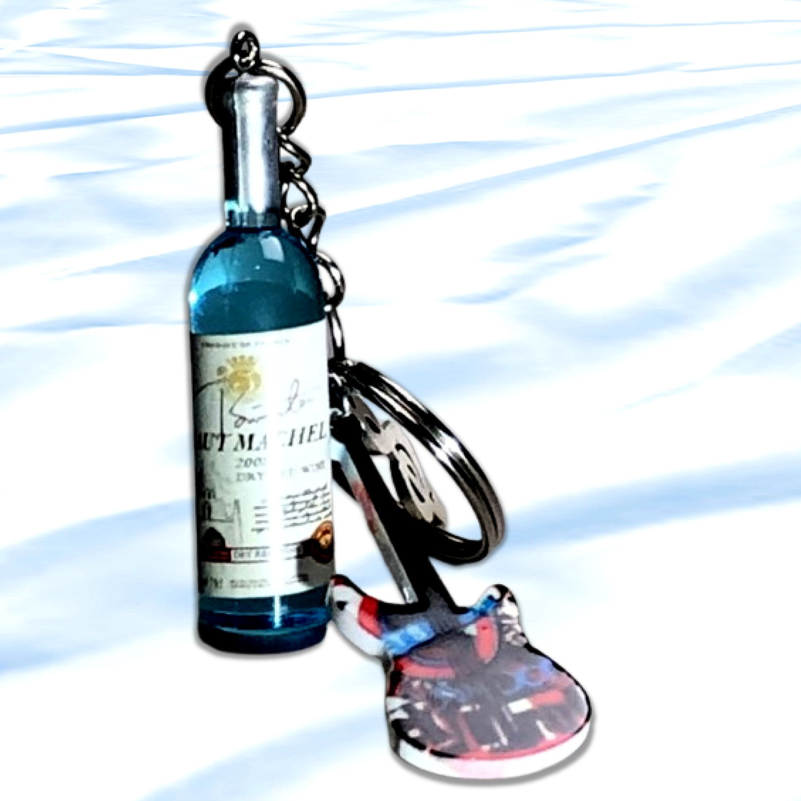 Blue wine bottle with charm and shoe, KCM Gifts4You on a white surface.