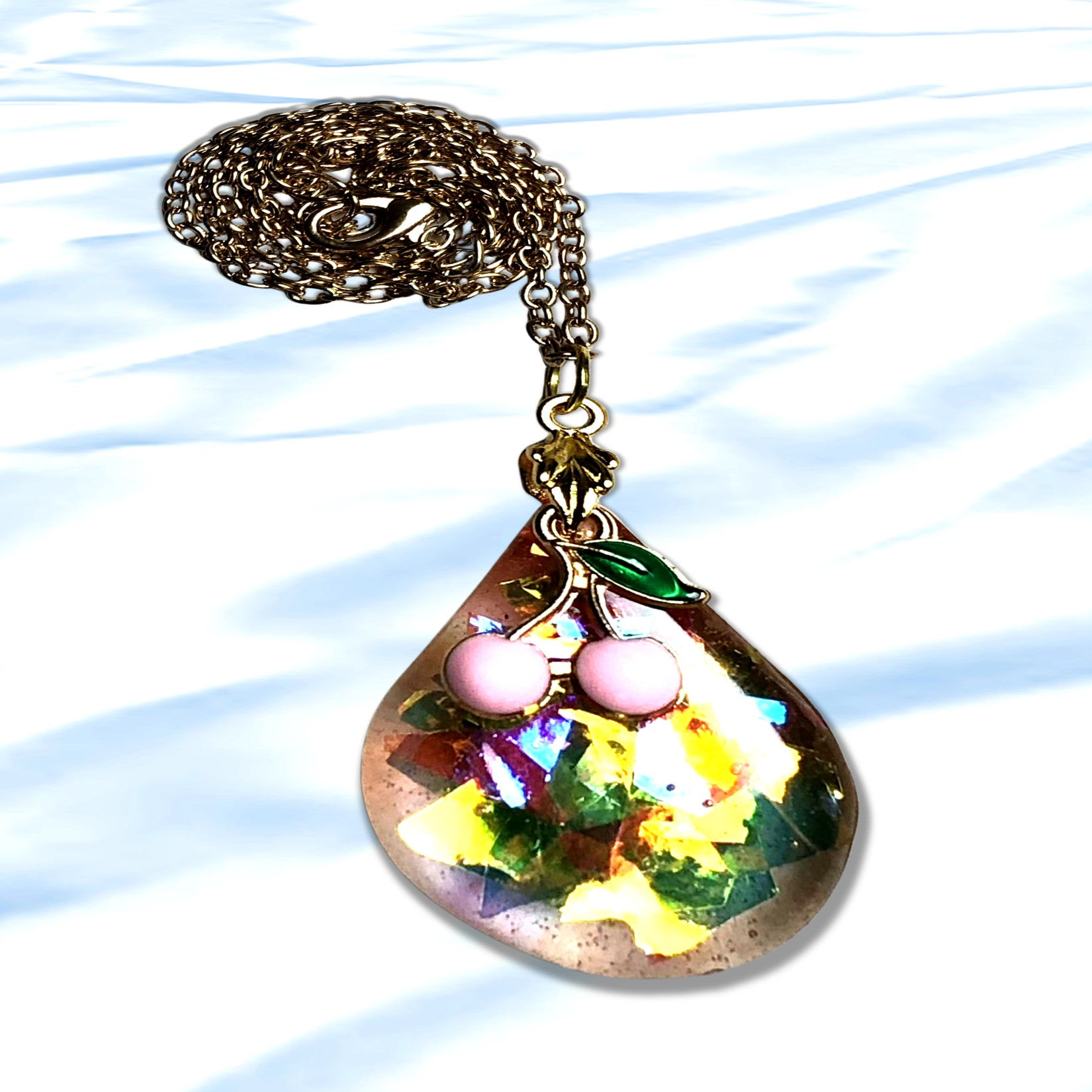 Elegant Seaside Waterdrop Pendant Necklace, silver chain, colorful detail, and background.