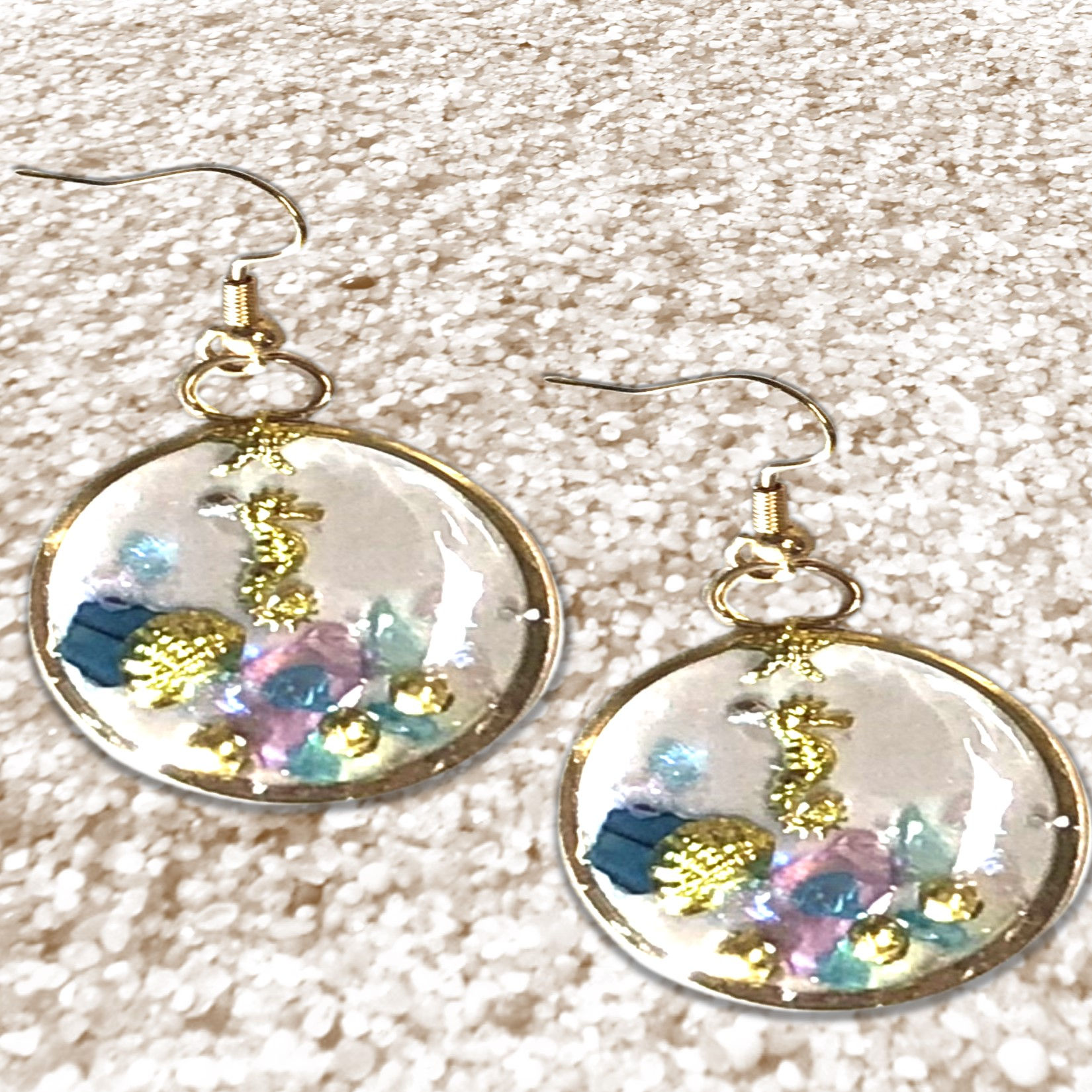 Sparkling Swirl Pearlescent Resin Earrings with floral design on a neutral background KCM Gifts4You
