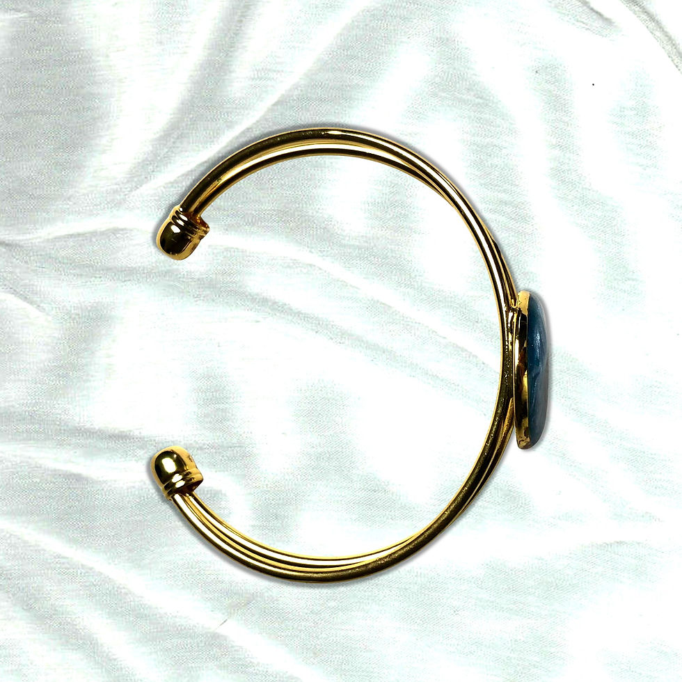Thumbnail: Gold bracelet with a beach and ocean setting charm on satin background. KCM Gifts4You