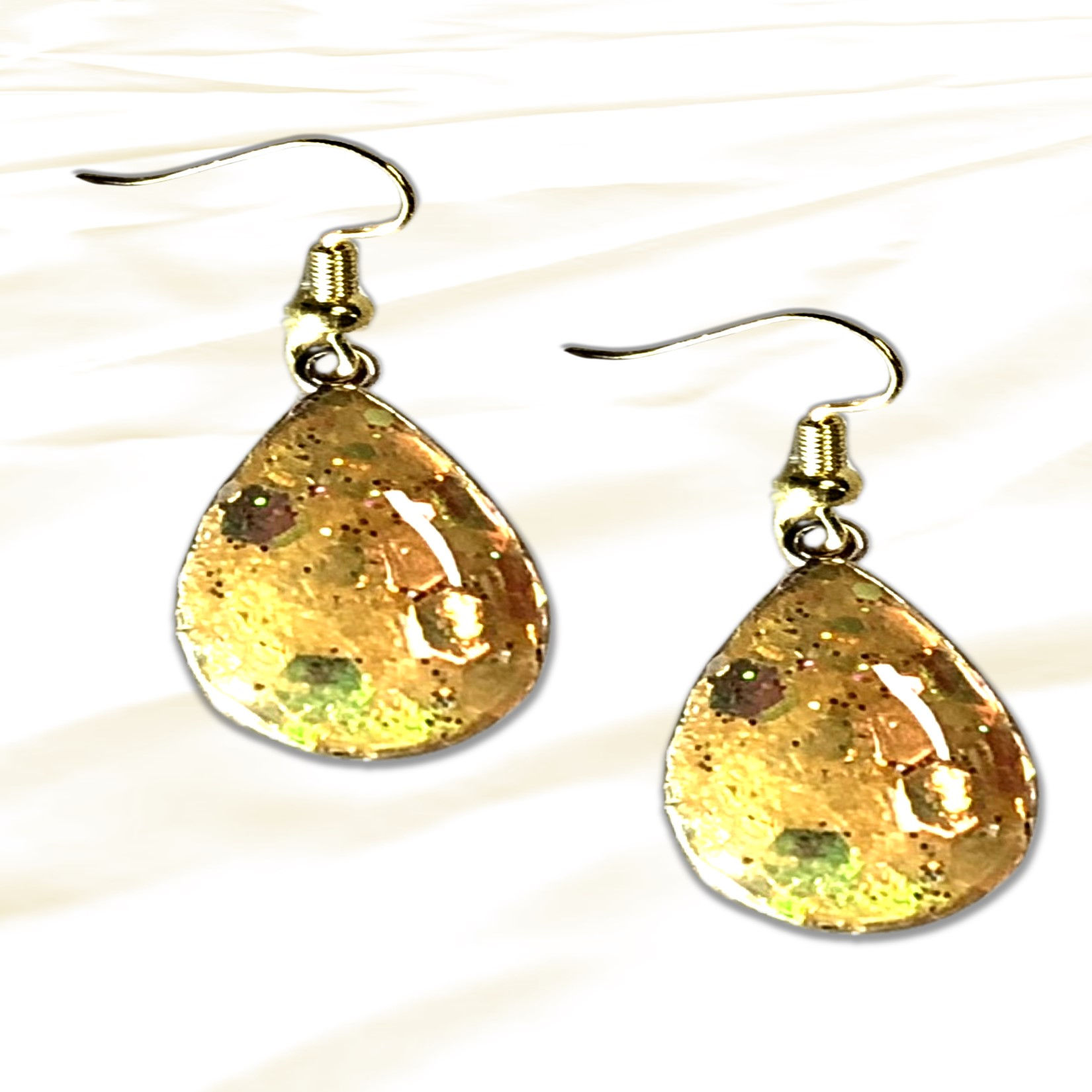 Pair of gold teardrop earrings with abstract design, KCM Gifts4You.