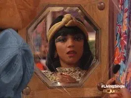 Cleopatra admiring her hair extensions