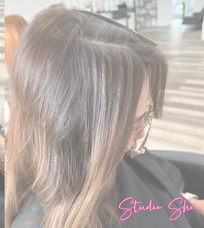 Stylist combing hair and preparing for extensions, Studio She Salon, hair extension salons near me.