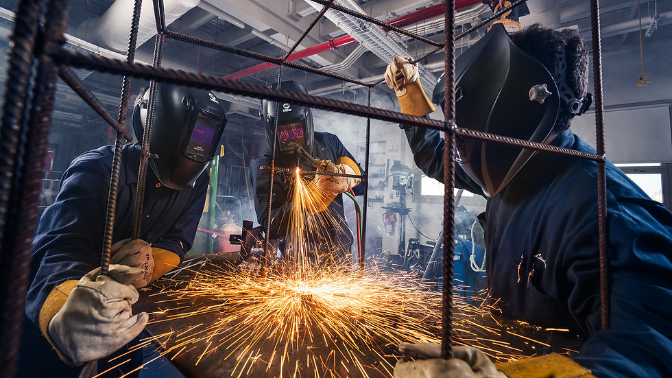 Student welders working on metal fabrication, photo by Von Wong